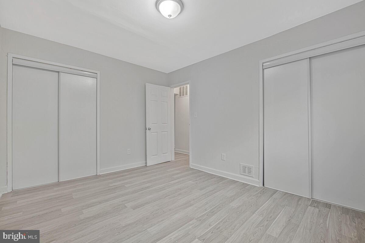 107 Joliet Street Washington, DC 20032 - Photo 17 of 52 a view of an empty room and wooden floor