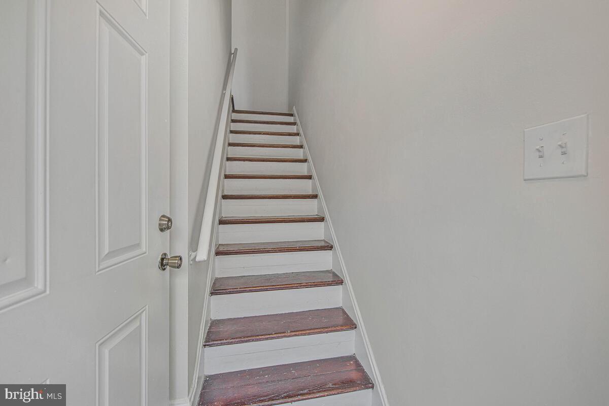 107 Joliet Street Washington, DC 20032 - Photo 21 of 52 a view of staircase with white walls