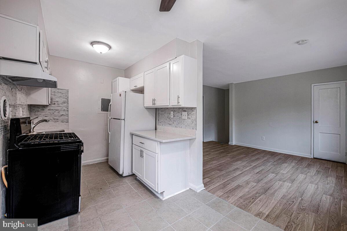 107 Joliet Street Washington, DC 20032 - Photo 27 of 52 a kitchen with a stove and a refrigerator
