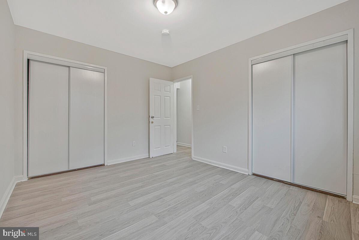 107 Joliet Street Washington, DC 20032 - Photo 35 of 52 a view of an empty room with wooden floor