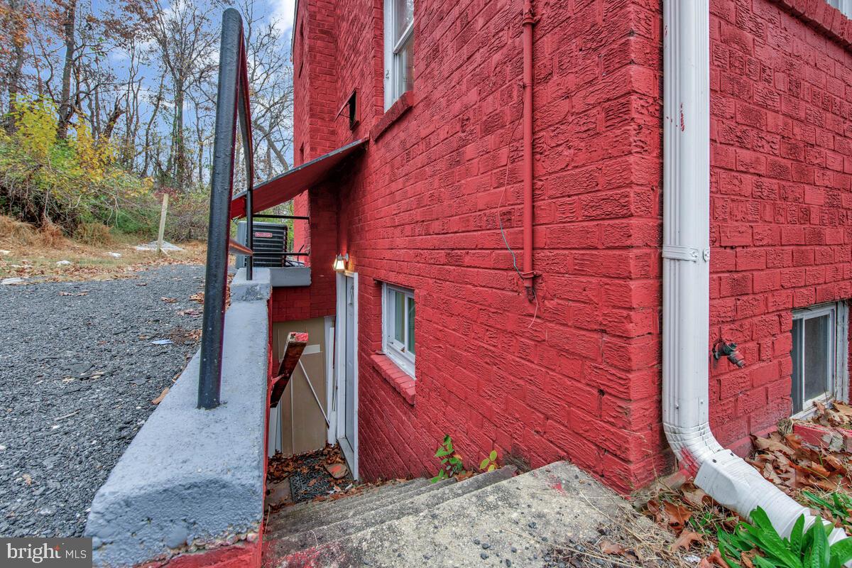 107 Joliet Street Washington, DC 20032 - Photo 38 of 52 a view of a wooden door and a tree