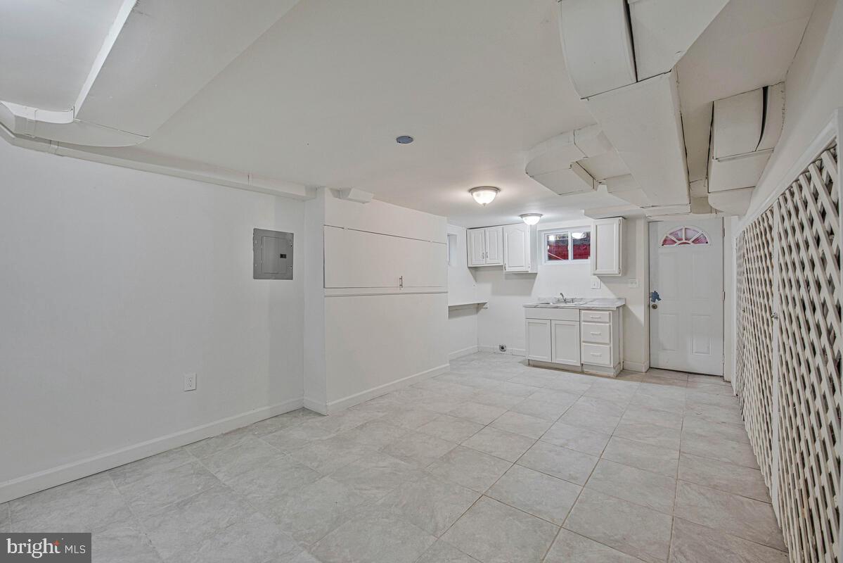 107 Joliet Street Washington, DC 20032 - Photo 41 of 52 a room with white cabinets and white appliances