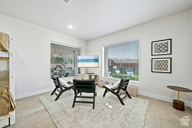 6026 Zen Trail Way St. George, UT 84790 - Photo 23 of 41 Dining room featuring light wood-style flooring, a textured ceiling, and recessed lighting
