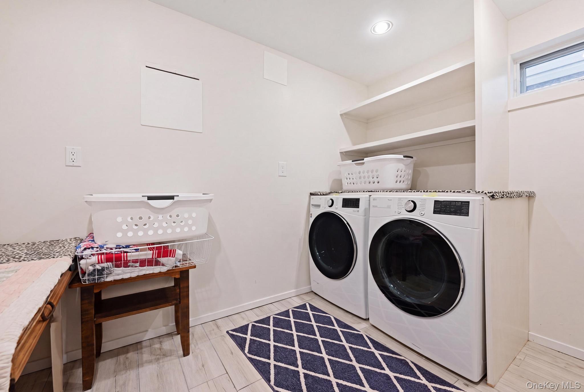 19 Sunset Road West Albertson, NY 11507 - Photo 20 of 24 Dedicated laundry area featuring a granite-look countertop, integrated shelving, and light wood-finish flooring