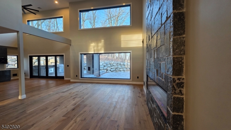 27 Sanders Road Rockaway, NJ 07866 - Photo 11 of 16 a view of an empty room with wooden floor and a window