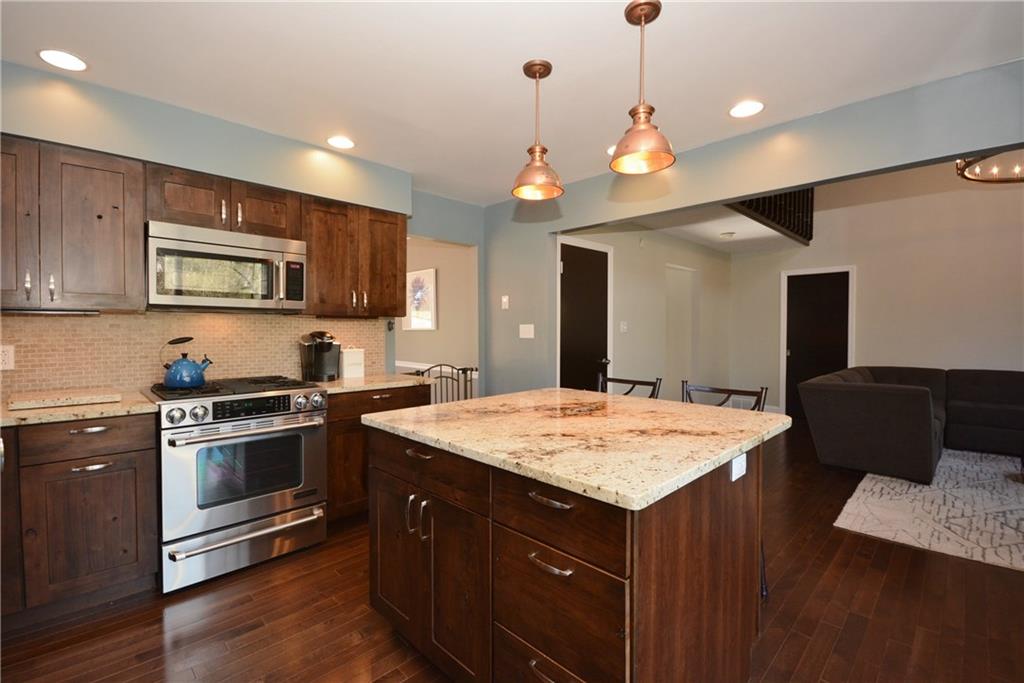 1222 Driftwood Drive Mt. Lebanon, PA 15243 - Photo 11 of 25 a kitchen with a stove and a refrigerator