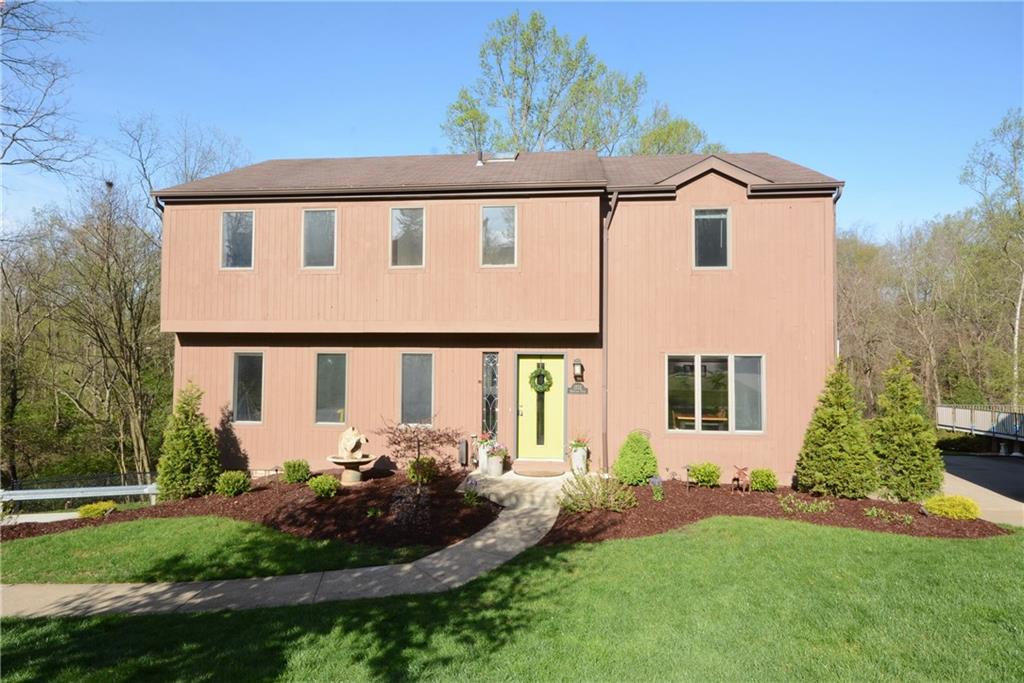 1222 Driftwood Drive Mt. Lebanon, PA 15243 - Photo 2 of 25 a front view of a house with garden
