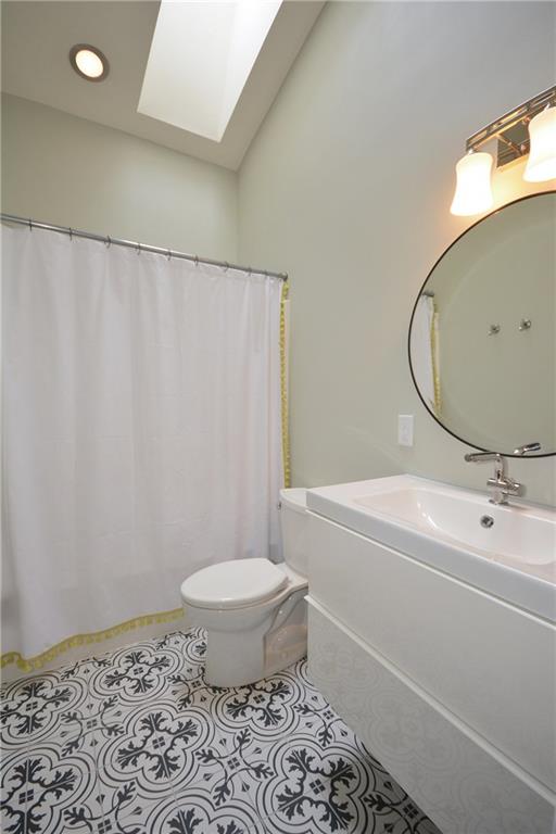 1222 Driftwood Drive Mt. Lebanon, PA 15243 - Photo 22 of 25 a bathroom with a sink toilet and shower