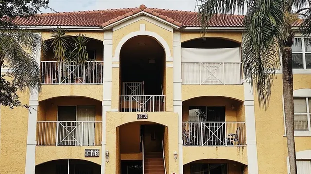 a front view of a house with a garage