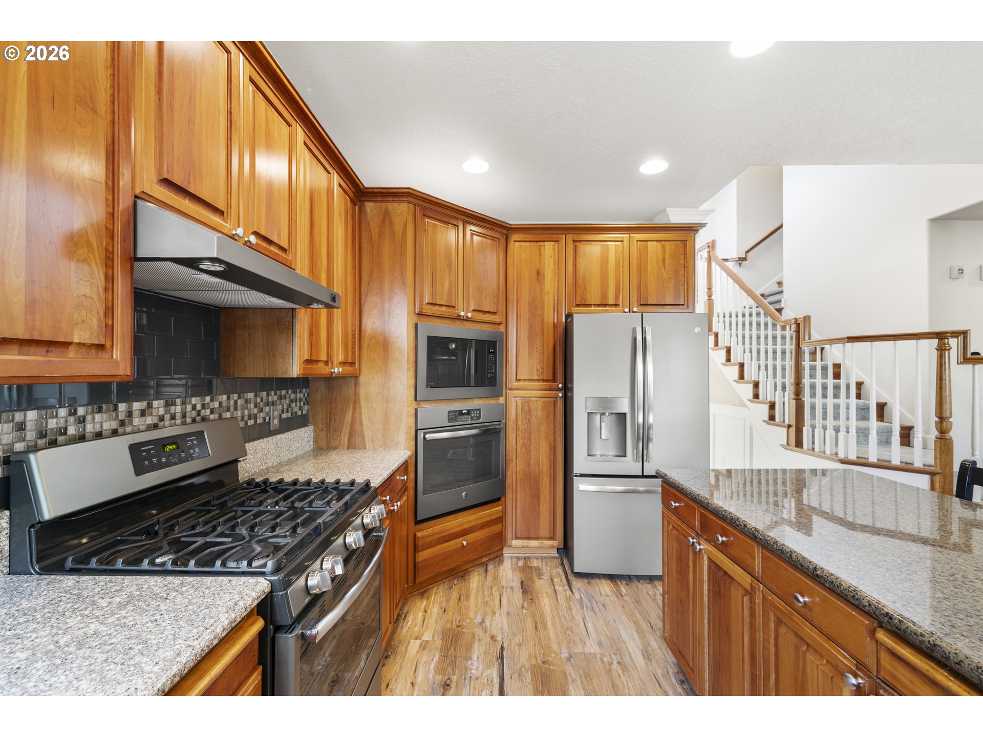 535 Maple Street Mount Angel, OR 97362 - Photo 13 of 48 a kitchen with stainless steel appliances granite countertop a refrigerator and a sink