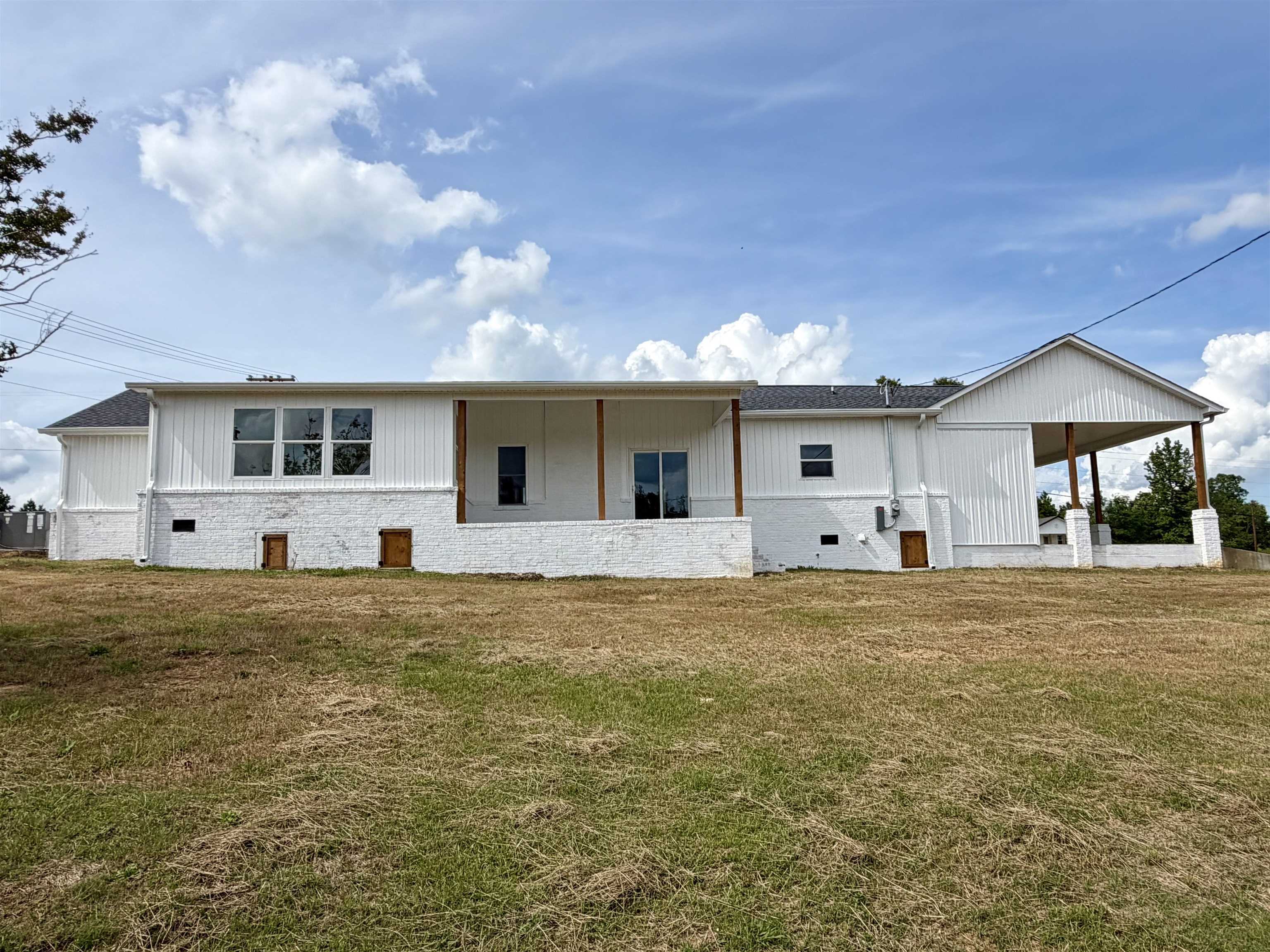 172 New Bethel Road Selmer, TN 38375 - Photo 29 of 30 a front view of a house with a garden and yard