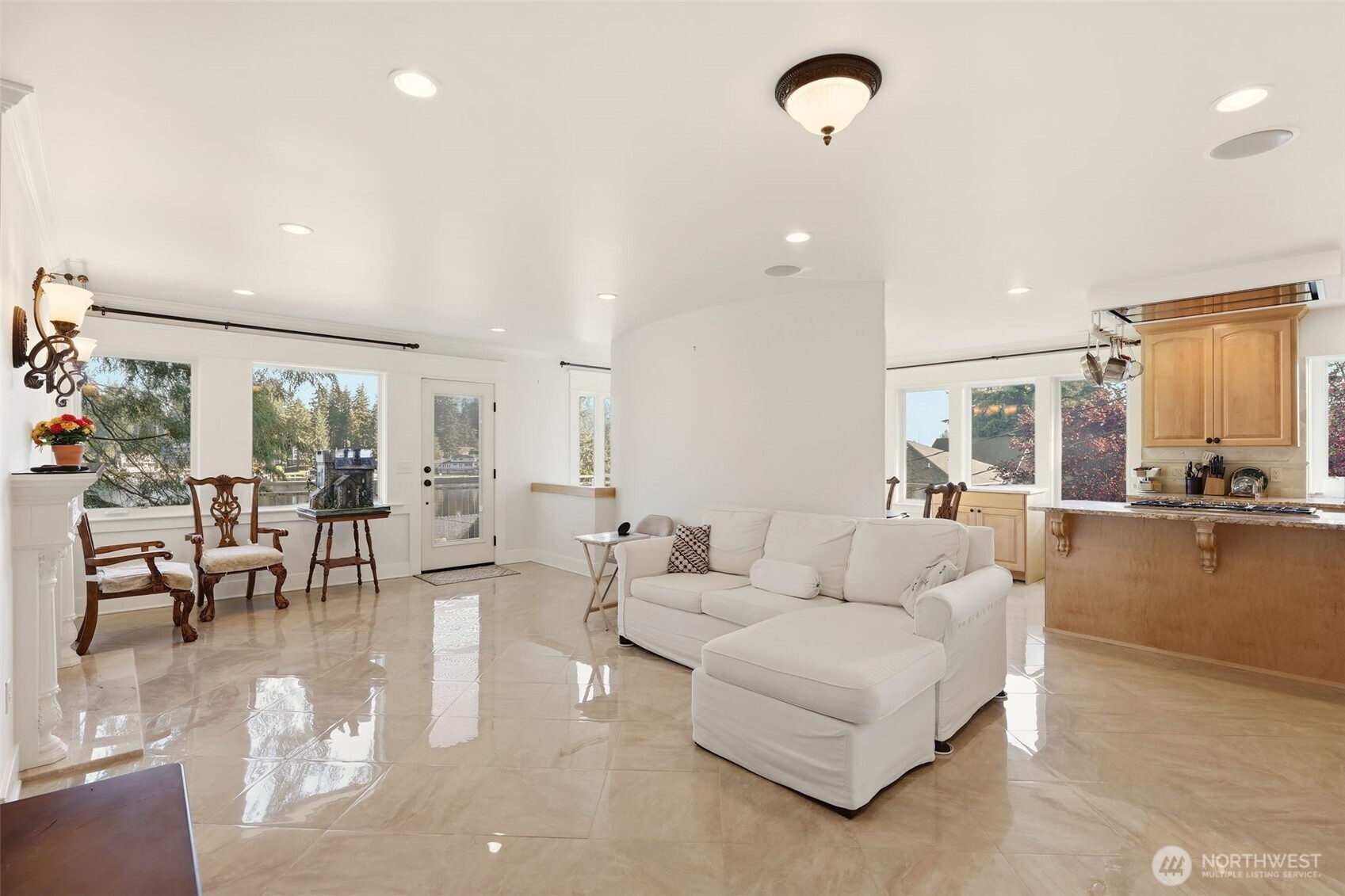 3821 Shelby Road Lynnwood, WA 98087 - Photo 14 of 40 a living room with couches and kitchen view with wooden floor