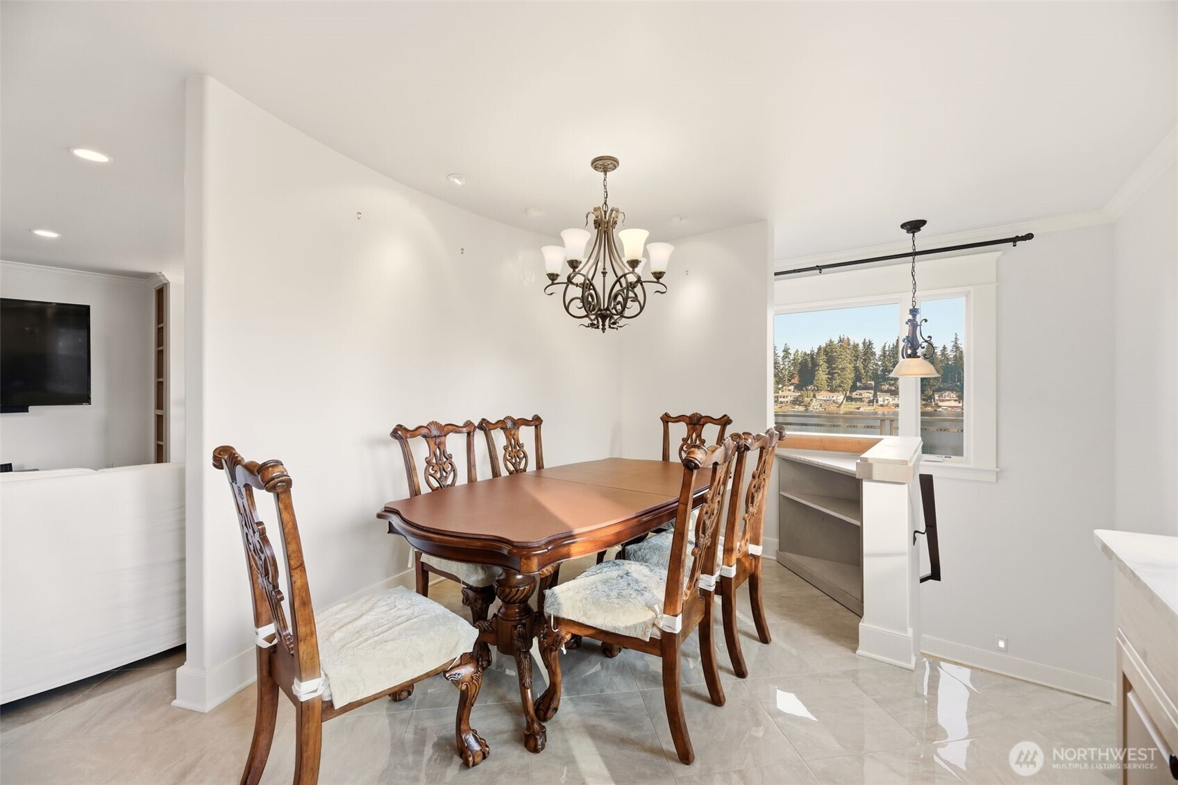 3821 Shelby Road Lynnwood, WA 98087 - Photo 16 of 40 a dining room with furniture a chandelier and window