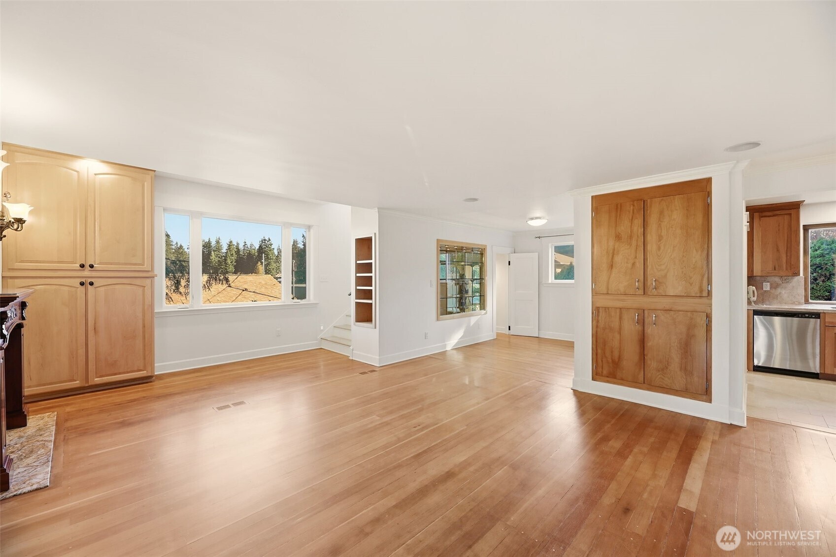 3821 Shelby Road Lynnwood, WA 98087 - Photo 25 of 40 a view of a kitchen with wooden floor and a refrigerator