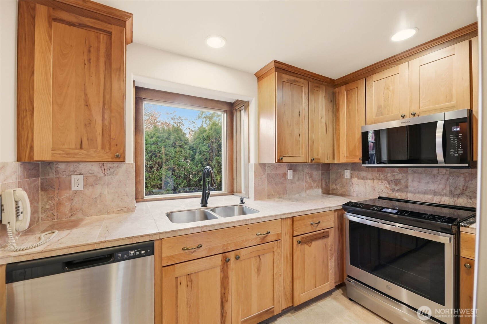 3821 Shelby Road Lynnwood, WA 98087 - Photo 26 of 40 a kitchen with stainless steel appliances a sink stove and microwave