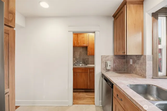 a kitchen with a sink and a refrigerator