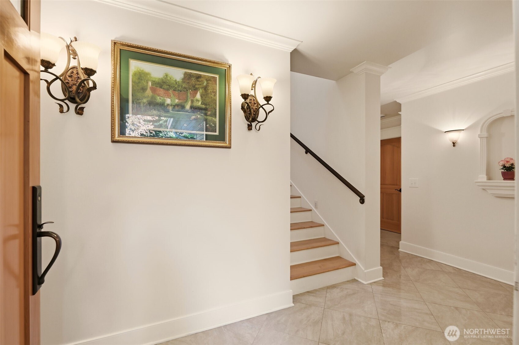 3821 Shelby Road Lynnwood, WA 98087 - Photo 3 of 40 a view of a hallway with paintings on the wall