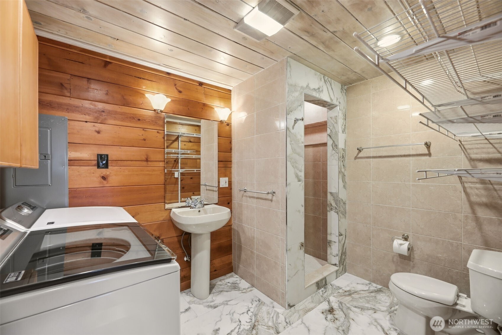 3821 Shelby Road Lynnwood, WA 98087 - Photo 31 of 40 a bathroom with a sink a toilet and shower