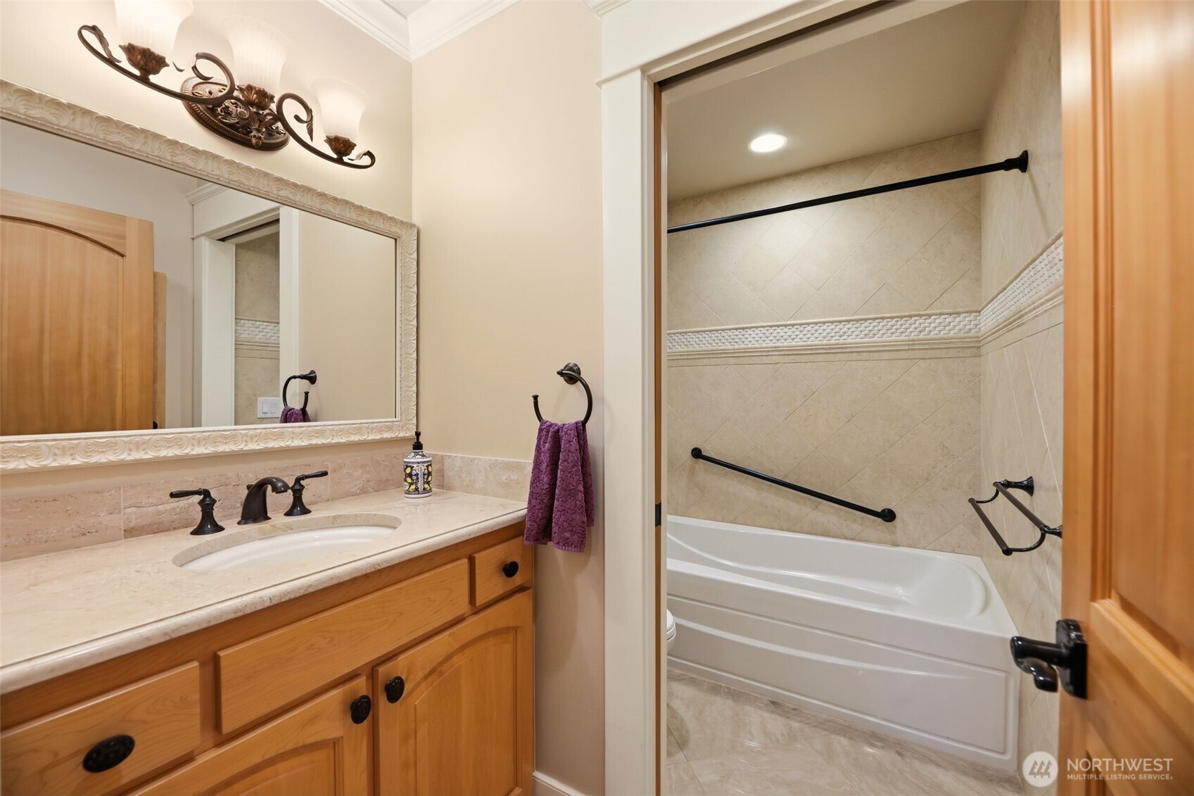 3821 Shelby Road Lynnwood, WA 98087 - Photo 7 of 40 a bathroom with a sink and a mirror