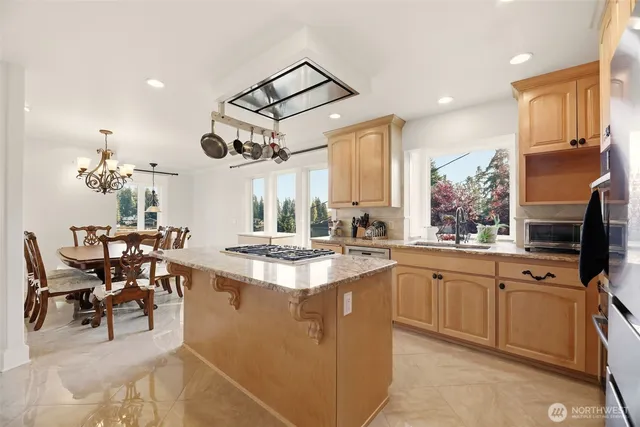 a kitchen with cabinets a sink and appliances