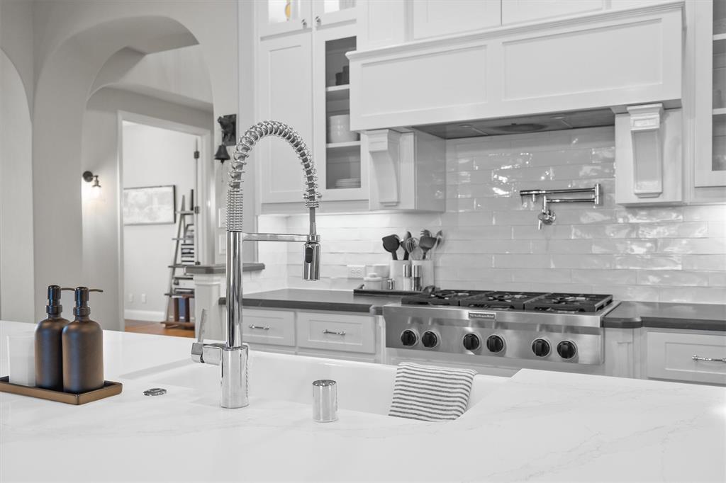 11459 Misty Ridge Drive Flower Mound, TX 76262 - Photo 15 of 38 a kitchen with a stove and cabinets