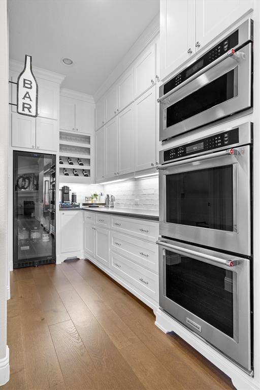 11459 Misty Ridge Drive Flower Mound, TX 76262 - Photo 18 of 38 a kitchen with cabinets stainless steel appliances and a counter space