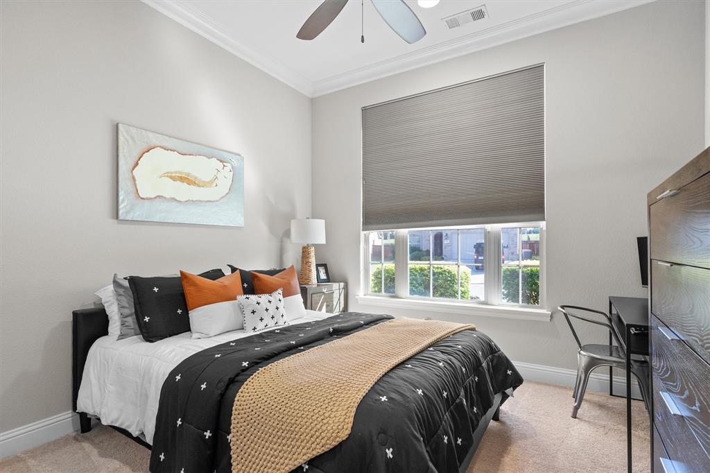 11459 Misty Ridge Drive Flower Mound, TX 76262 - Photo 26 of 38 a bedroom with a bed and a painting on the wall