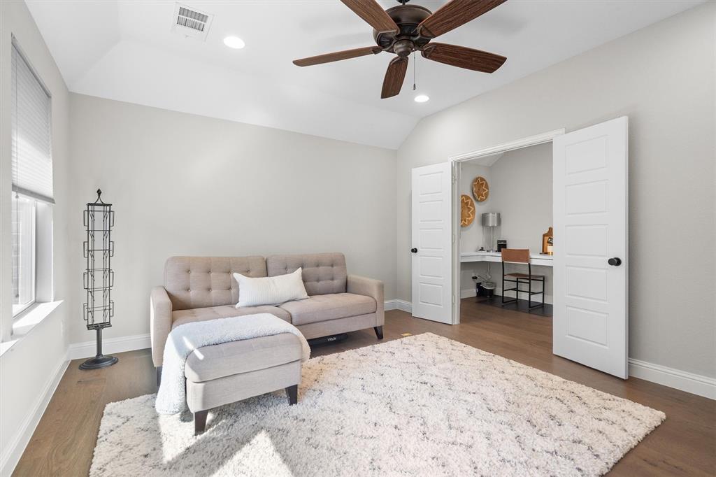 11459 Misty Ridge Drive Flower Mound, TX 76262 - Photo 31 of 38 a living room with furniture and a rug