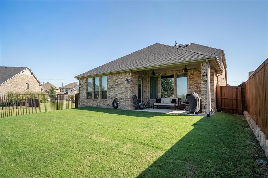 11459 Misty Ridge Drive Flower Mound, TX 76262 - Photo 34 of 38 a view of a house with a yard and porch
