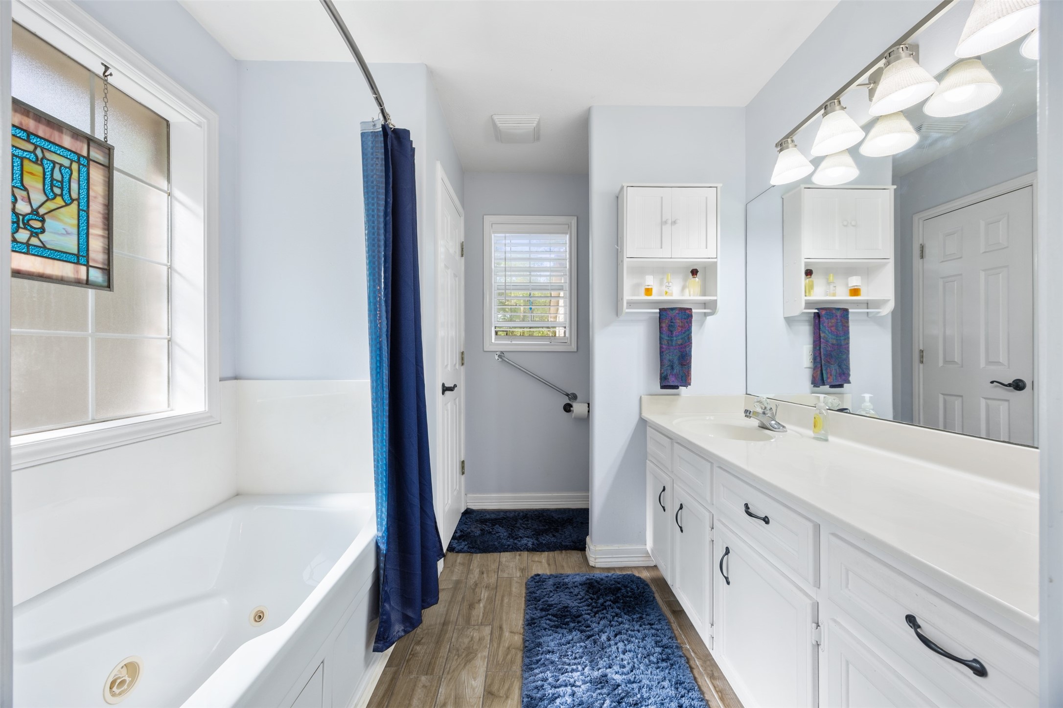 80 Indian Harbor Trinity, TX 75862 - Photo 16 of 47 a bathroom with a tub sink and mirror