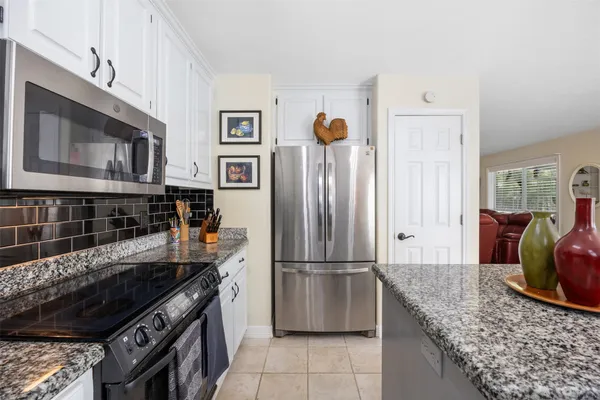 a view of a hallway with washer and dryer