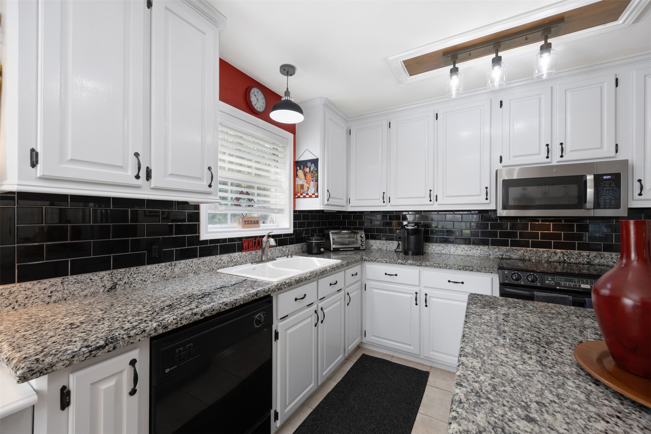 80 Indian Harbor Trinity, TX 75862 - Photo 24 of 47 a kitchen with stainless steel appliances granite countertop a sink stove and cabinets