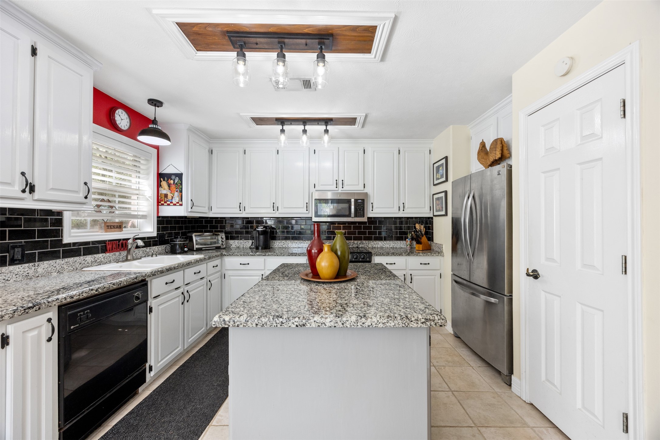 80 Indian Harbor Trinity, TX 75862 - Photo 25 of 47 a kitchen with stainless steel appliances granite countertop a sink and a refrigerator