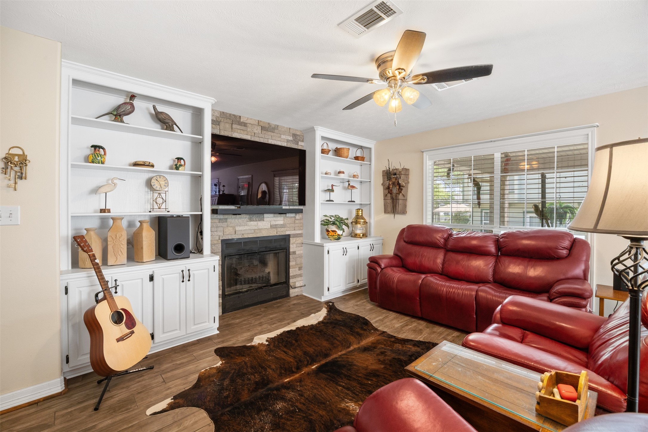 80 Indian Harbor Trinity, TX 75862 - Photo 29 of 47 a living room with furniture a flat screen tv and a fireplace