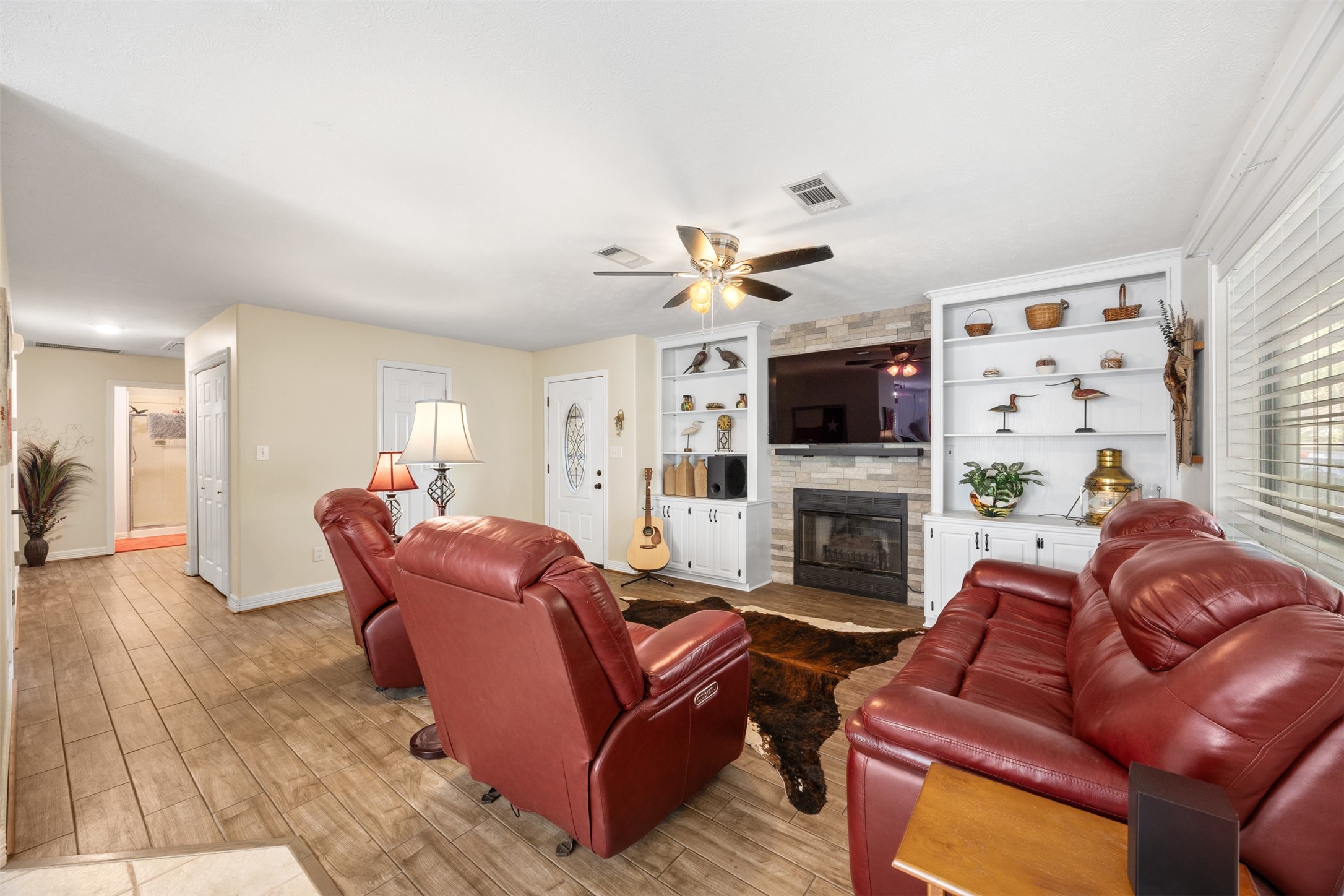 80 Indian Harbor Trinity, TX 75862 - Photo 30 of 47 a living room with furniture a fireplace and a flat screen tv