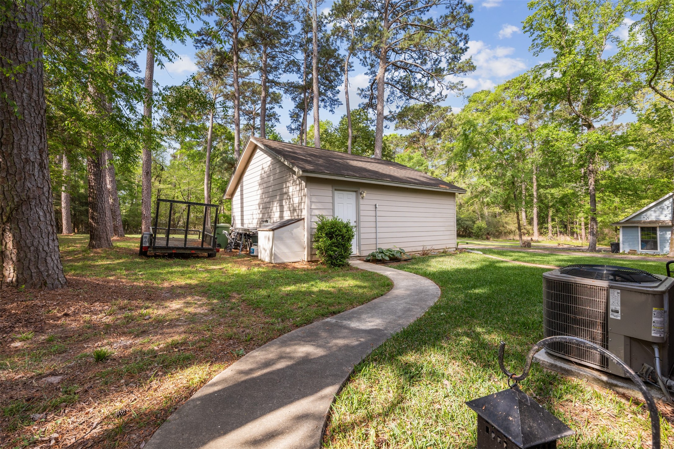 80 Indian Harbor Trinity, TX 75862 - Photo 6 of 47 a view of a backyard with table and chairs plants and trees