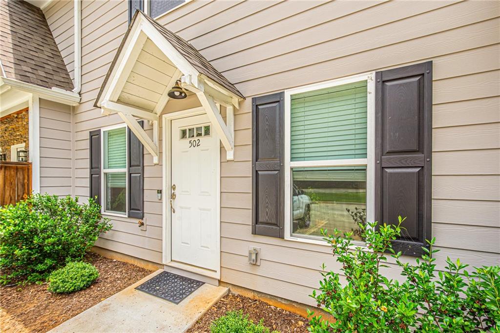 502 Wimpy Mill Road Dahlonega, GA 30533 - Photo 2 of 30 a view of a house with a small garden