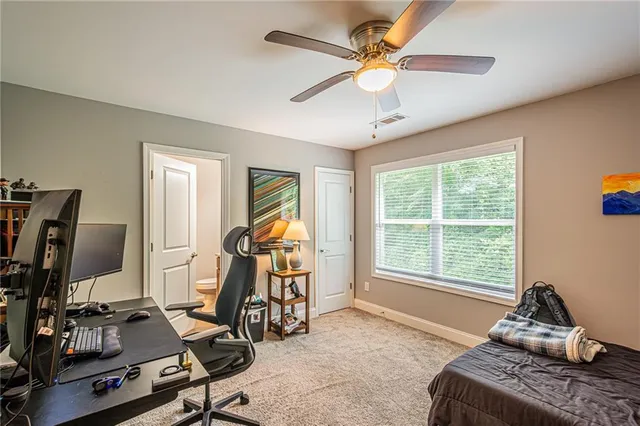 a room with gym equipment and windows