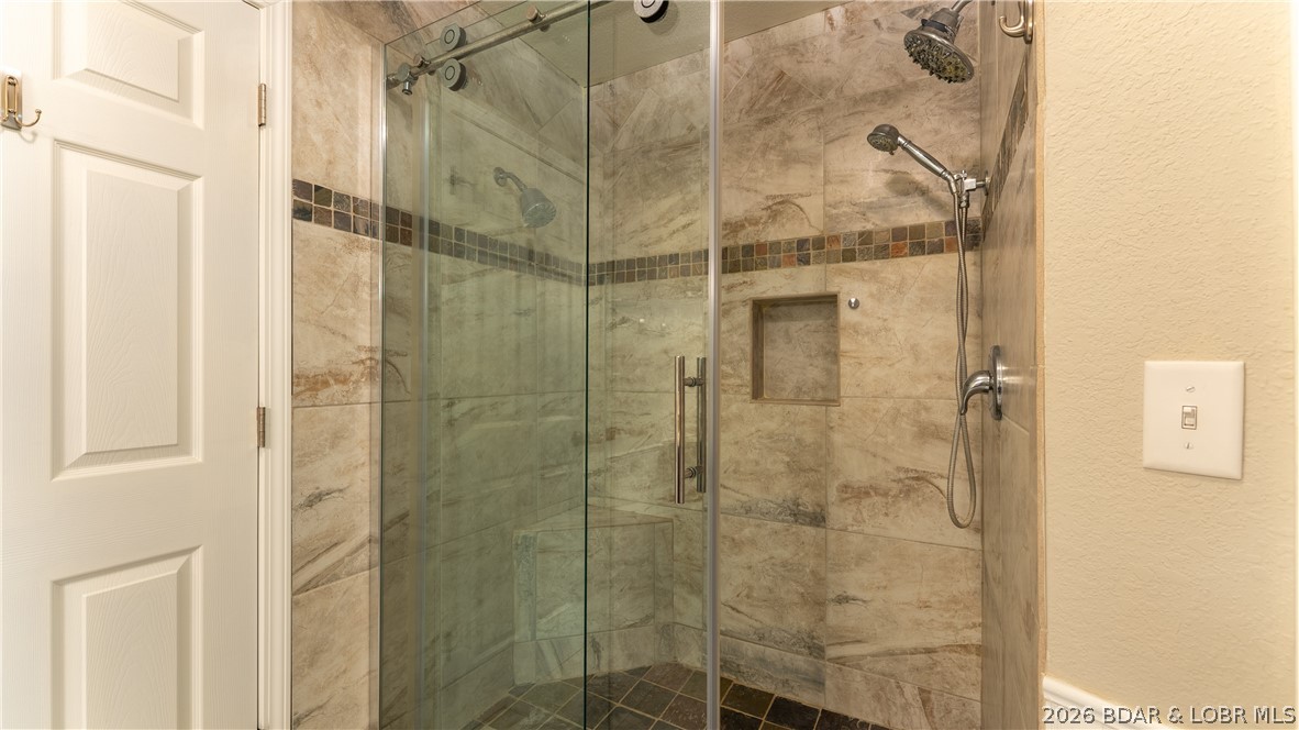 57 Arrowhead Beach Road Lake Ozark, MO 65049 - Photo 11 of 32 Updated walk-in tile shower