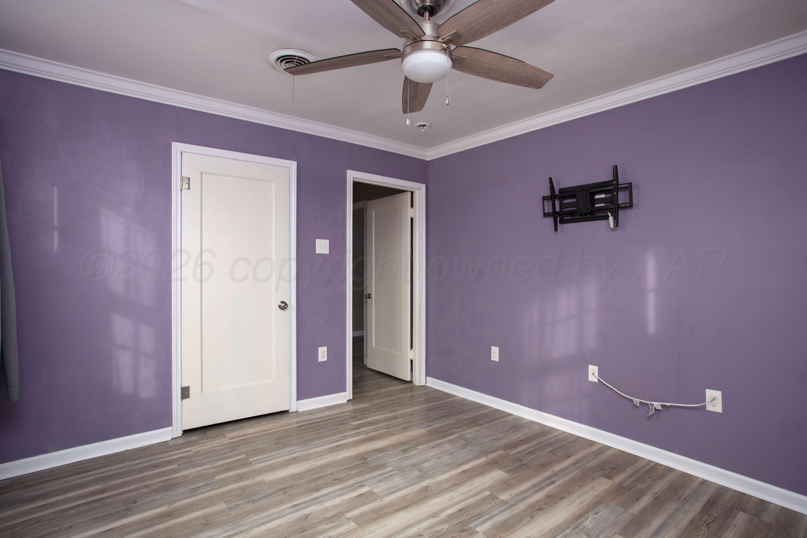 1616 South Travis Street Amarillo, TX 79102 - Photo 14 of 26 wooden floor and windows in a room