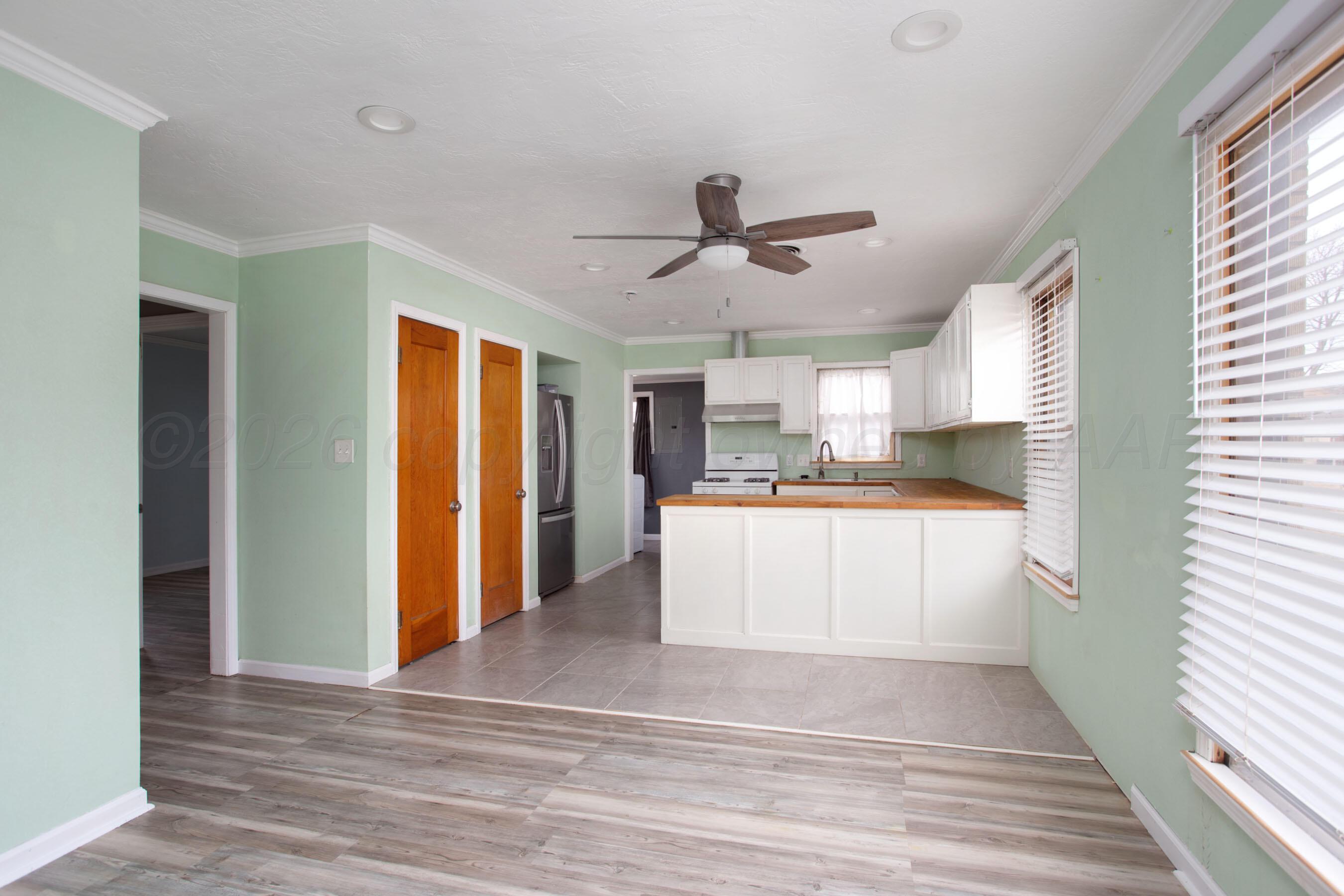 1616 South Travis Street Amarillo, TX 79102 - Photo 10 of 26 a view of kitchen with wooden floor