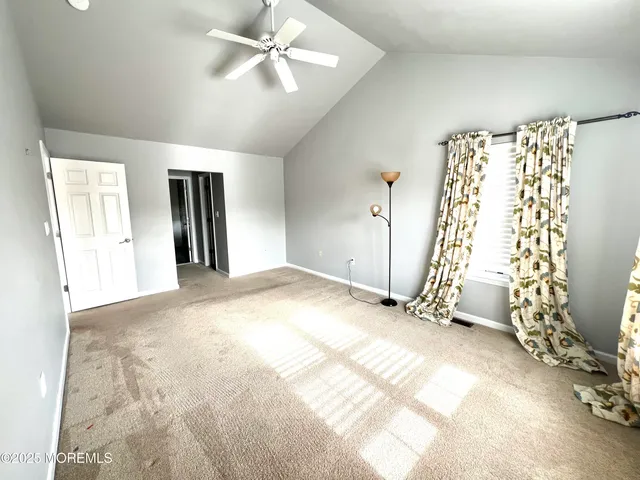 a spacious bathroom with double vanity a mirror a bathtub and a shower