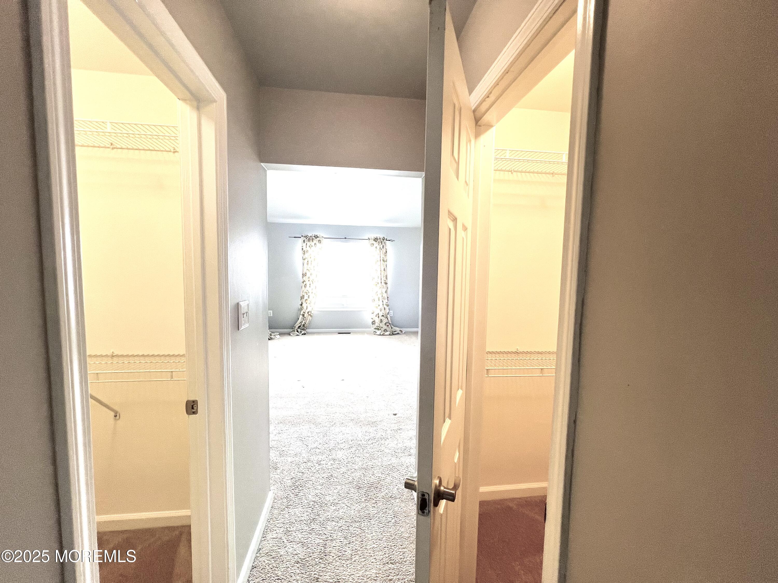 21 Durant Avenue, Unit 145 Holmdel, NJ 07733 - Photo 12 of 25 a view of an empty room and a window