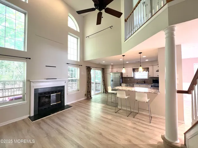 a view of living room with furniture and fireplace