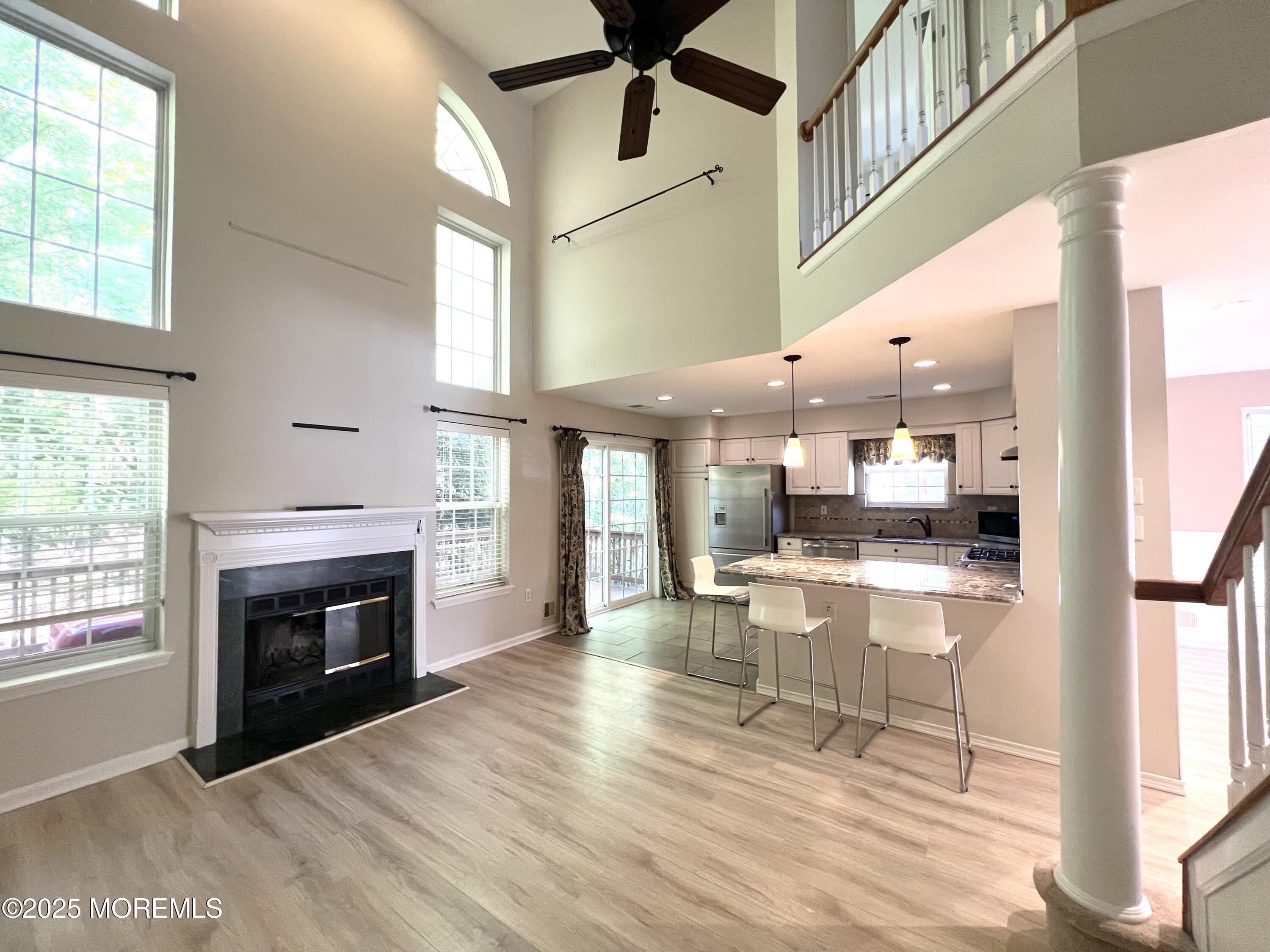 21 Durant Avenue, Unit 145 Holmdel, NJ 07733 - Photo 6 of 25 a view of living room with furniture and fireplace