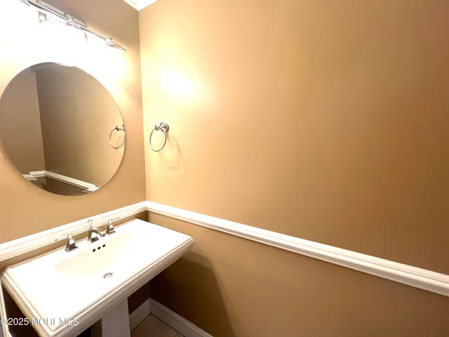 a view of a hallway with stairs