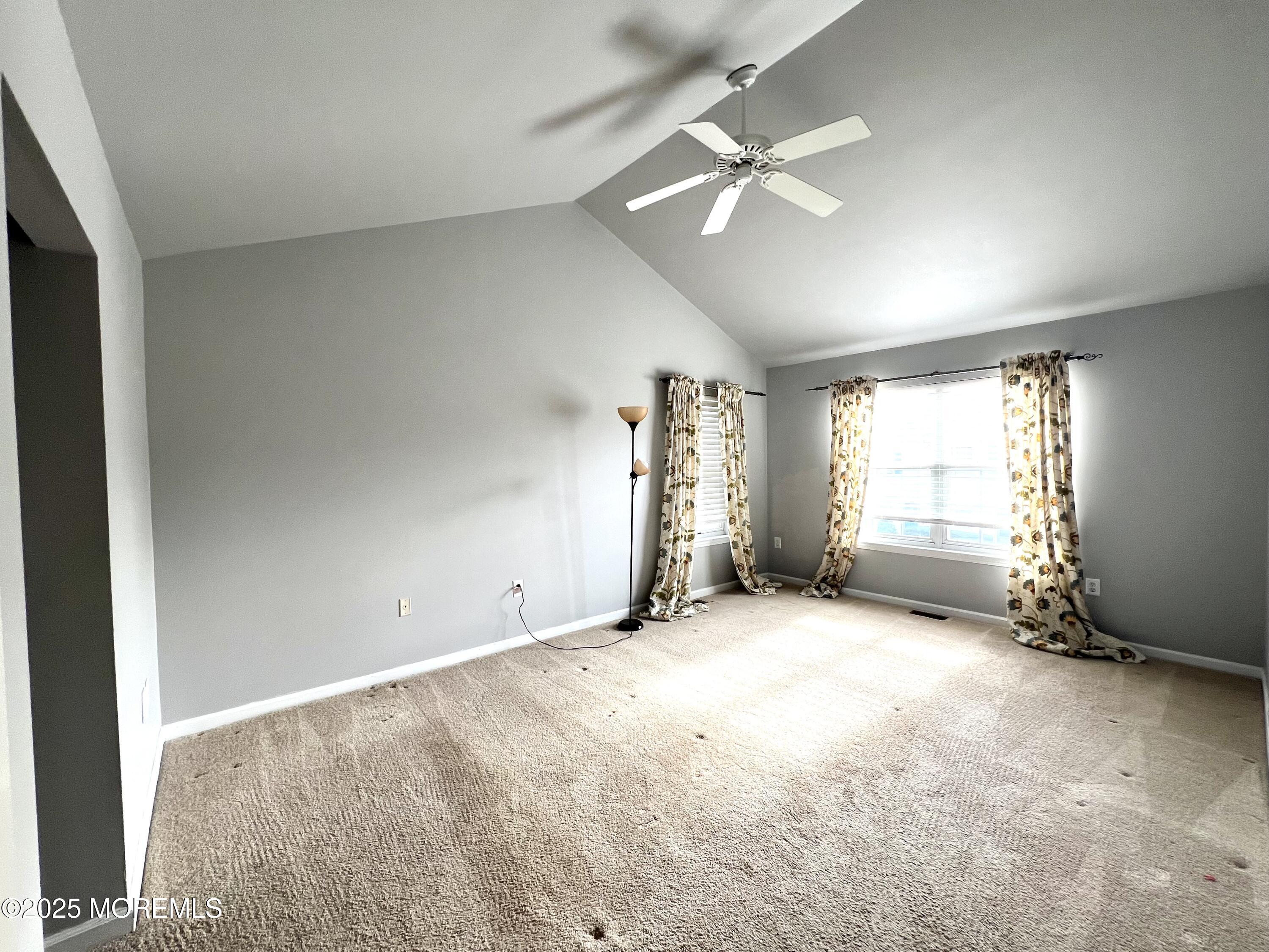 21 Durant Avenue, Unit 145 Holmdel, NJ 07733 - Photo 10 of 25 an empty room with windows and fan