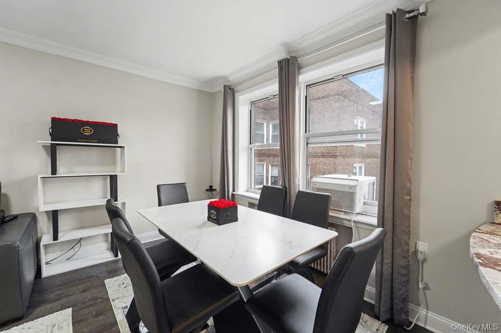 141-35 78th Road, Unit 2M Queens, NY 11367 - Photo 3 of 11 a view of a dining room with a table and chairs