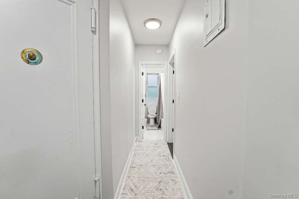 141-35 78th Road, Unit 2M Queens, NY 11367 - Photo 7 of 11 a view of hallway with wooden floor