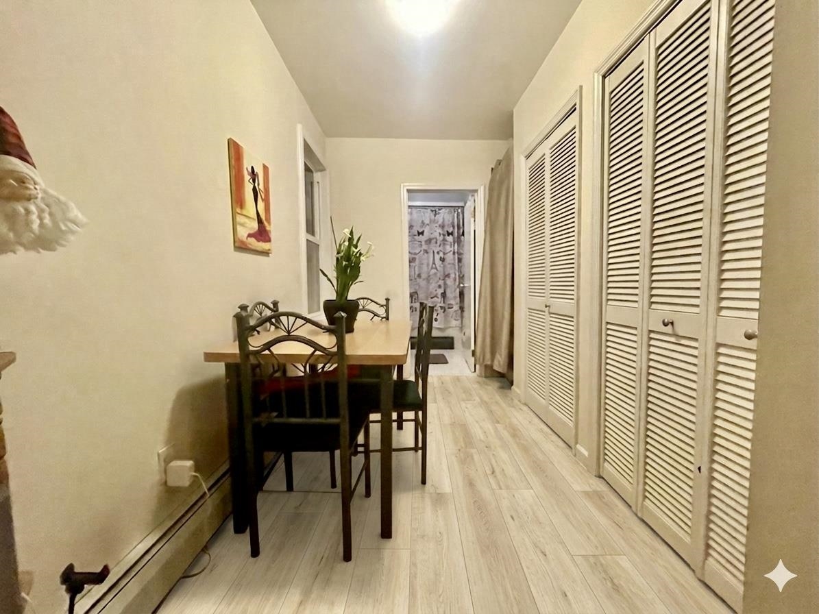 421 Adams Street, Unit 2L Hoboken, NJ 07030 - Photo 14 of 19 a view of a dining room with furniture and wooden floor